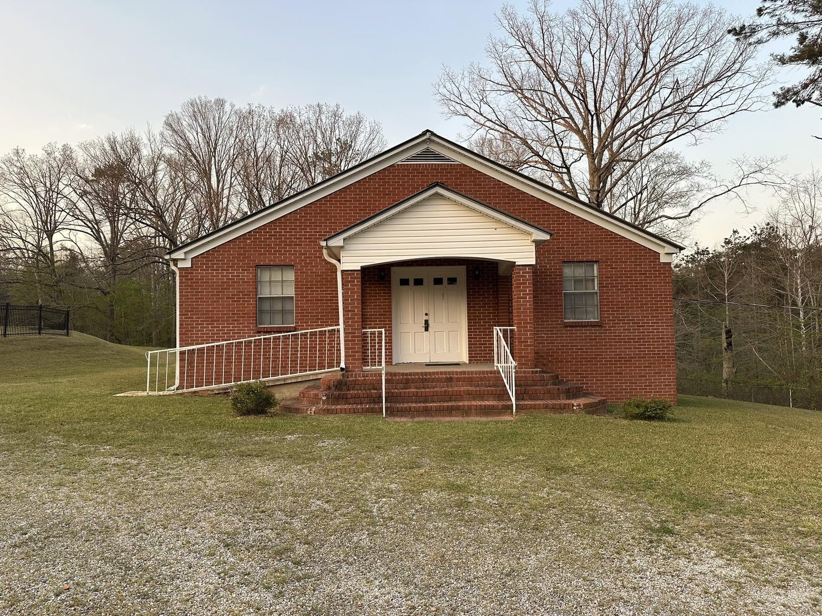 The red-brick Union Church building with white doors, in Thaxton, Mississippi